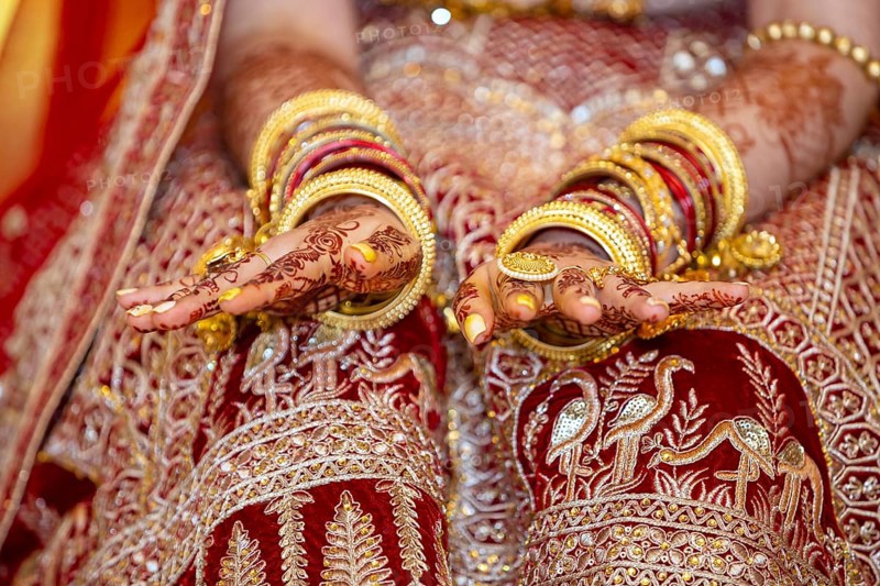 Traditional bridal jewelry and henna decoration on the hands of Hindu bride on her wedding day