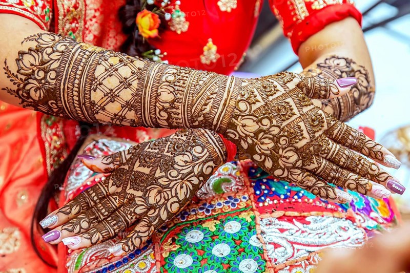 Beautiful henna design on the hand of a Hindu bride on her wedding eve