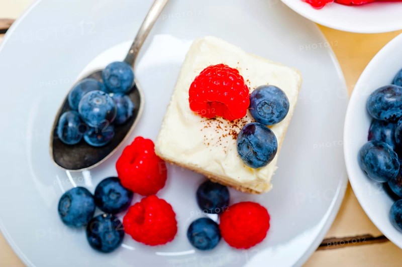 Fresh homemade raspberry and blueberry cream cake