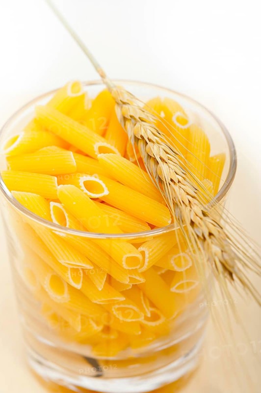 Short Italian pasta penne with durum wheat grains