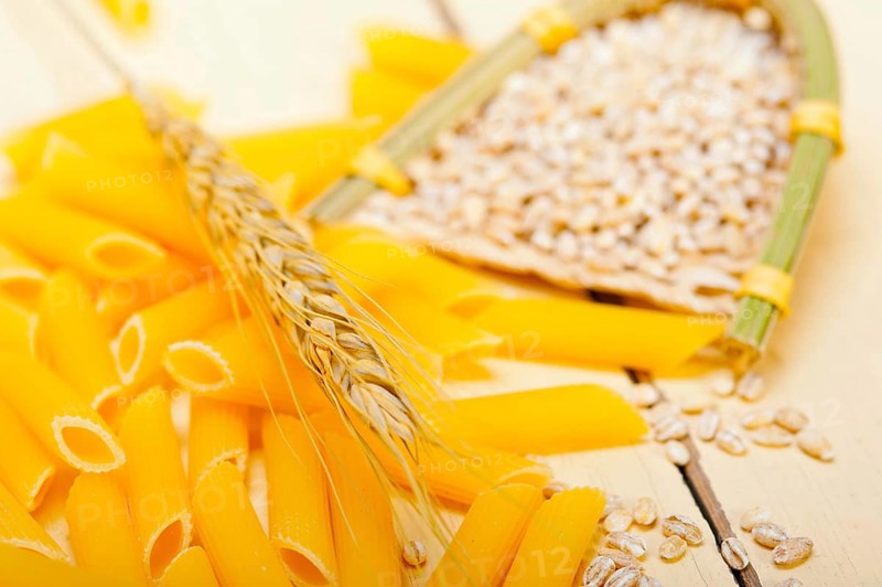Short Italian pasta penne with durum wheat grains