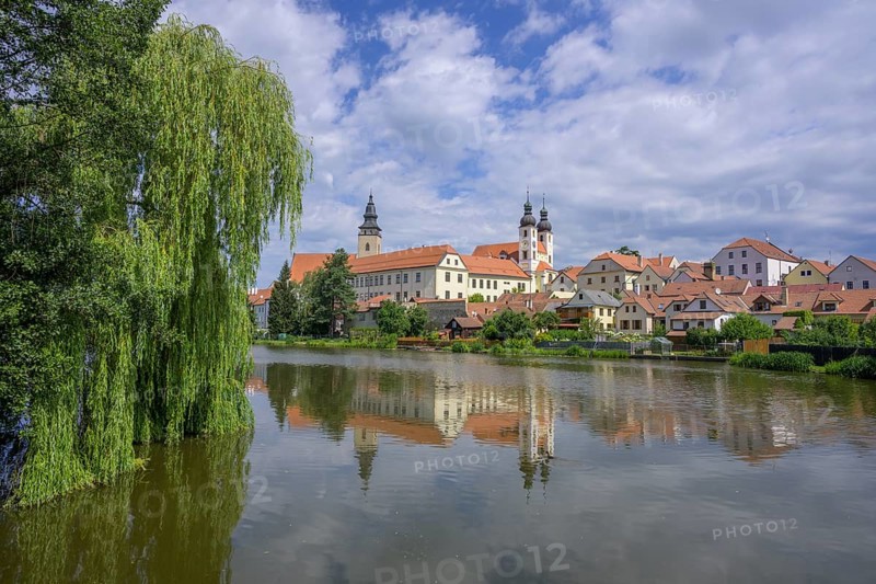 View over a pond to the old town of