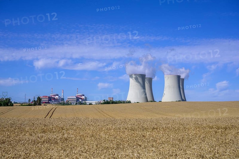 Grain field and cooling towers of the nuclear power plant
