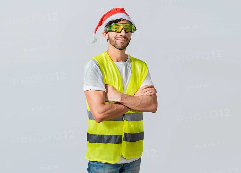 Portrait of a smiling engineer in a christmas hat