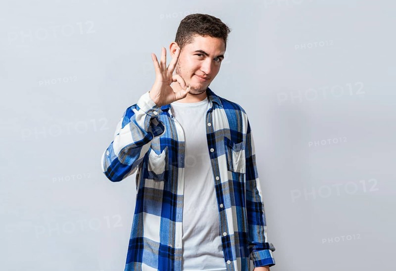 Handsome guy gesturing everything is ok