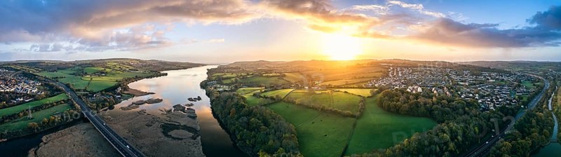 Panorama of Sunrise over Newton Abbot Bridge and River Teign from a drone