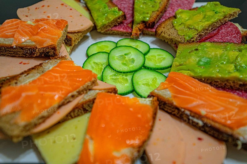 A bread plate with small canapes and various jumble