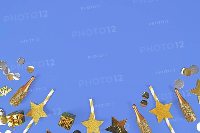 New year flat lay with golden party items on blue background with copy space