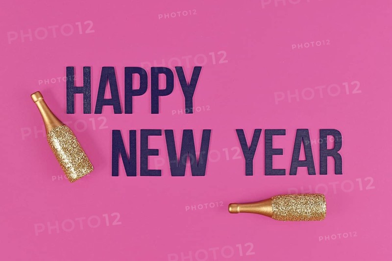 Happy New Year text with golden champagne bottles