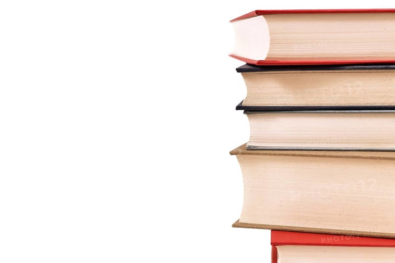 Stack of old hardcover books on side of white background with copy space