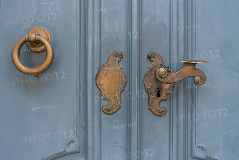 Historic brass door lock and knocker