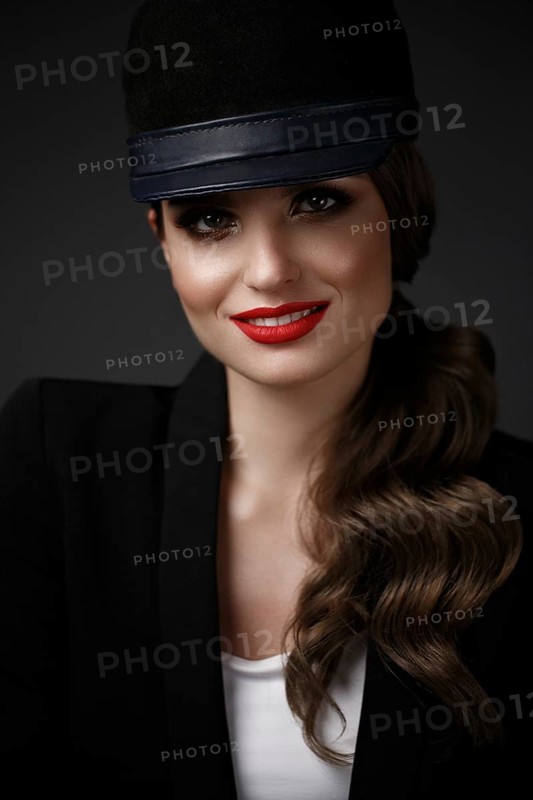 Beautiful sexy woman in a fashionable hat