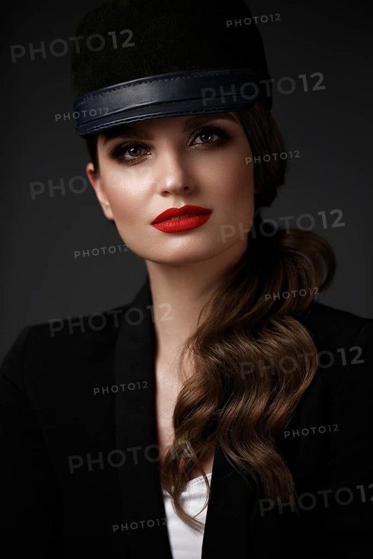 Beautiful sexy woman in a fashionable hat