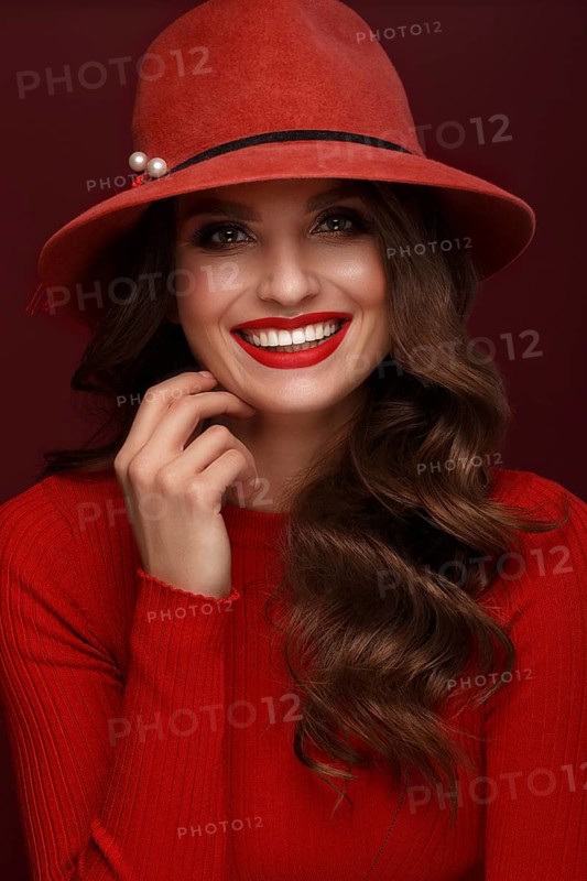 Beautiful sexy woman in a fashionable hat