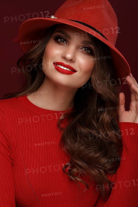 Beautiful sexy woman in a fashionable hat