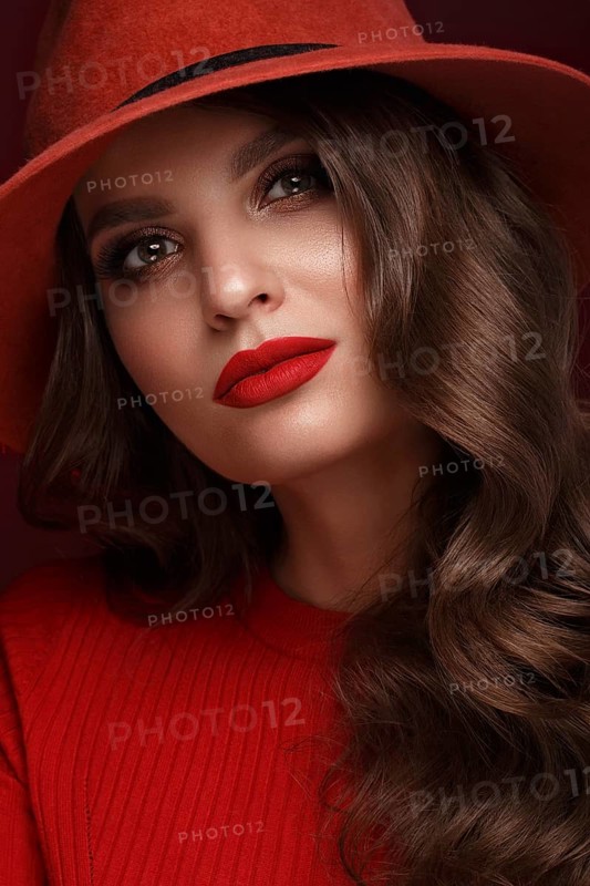 Beautiful sexy woman in a fashionable hat