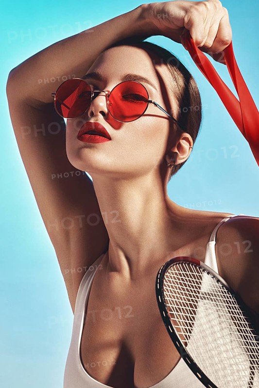 Beautiful attractive woman in a trendy swimsuit with sports equipment and accessories. Fashion photo session. beauty face