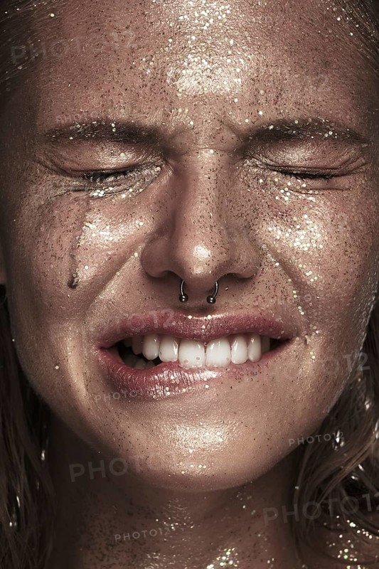 Portrait of a girl with emotion on her face. Photo taken in studio