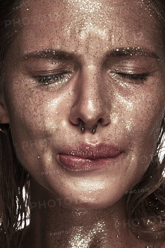 Portrait of a girl with emotion on her face. Photo taken in studio
