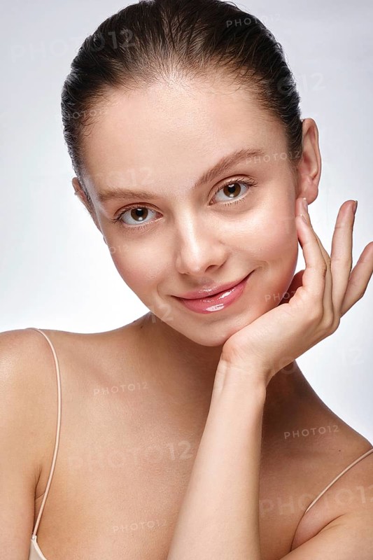 Portrait of beautiful woman with light natural make-up and perfect skin