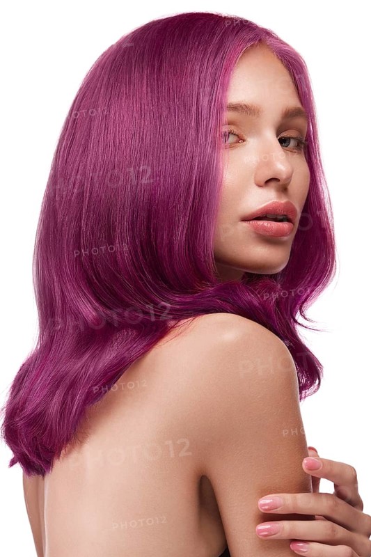 Beautiful girl with multi-colored hair and classic make-up and hairstyle. Beauty face. Photo taken in the studio