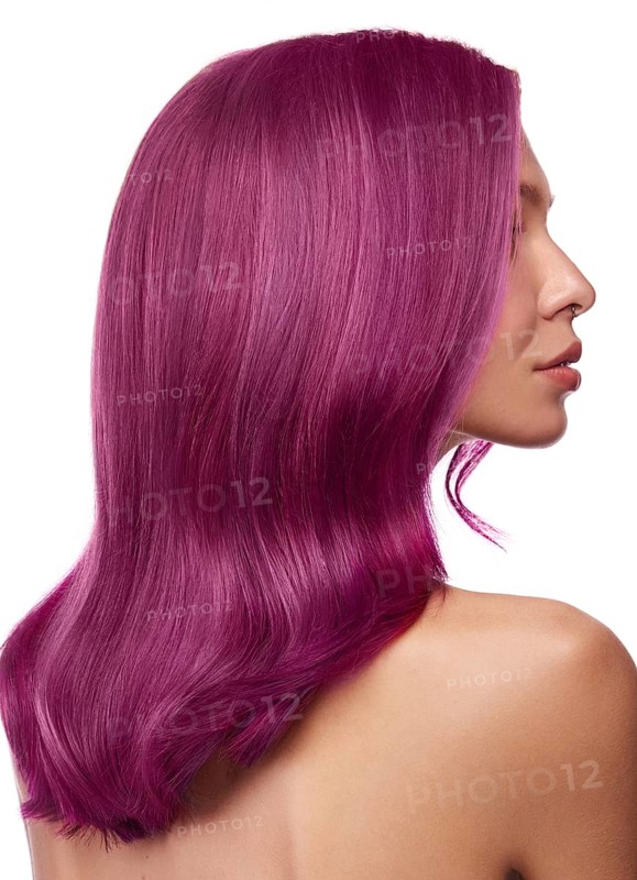 Beautiful girl with multi-colored hair and classic make-up and hairstyle. Beauty face. Photo taken in the studio