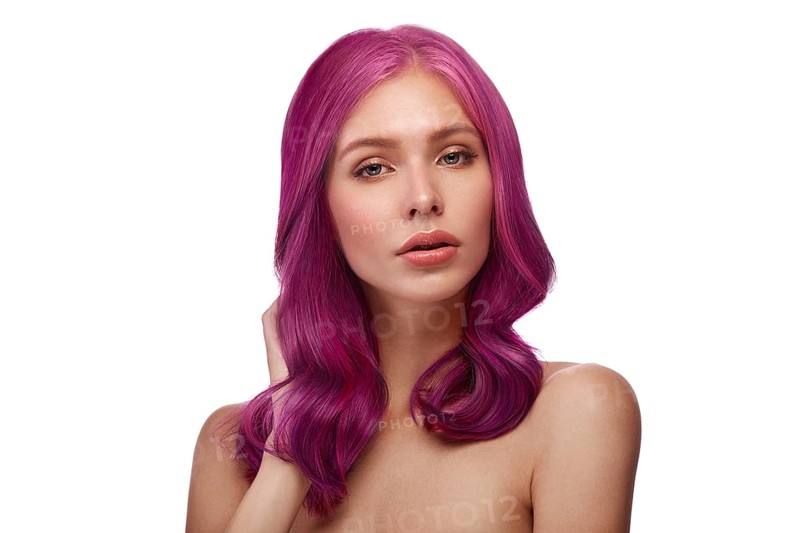 Beautiful girl with multi-colored hair and classic make-up and hairstyle. Beauty face. Photo taken in the studio