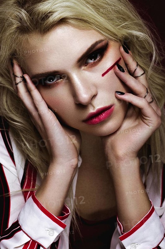 Beautiful girl with art make up in white striped shirt. beauty face. Photos shot in studio