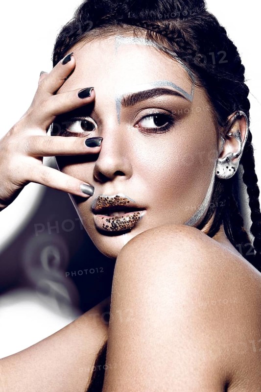 Portrait of a Beautiful fashionable girl with a creative glitter make-up
