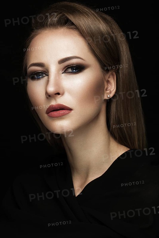 Beautiful girl in the Arab scarf with oriental make-up. Beauty face. Photos shot in the studio