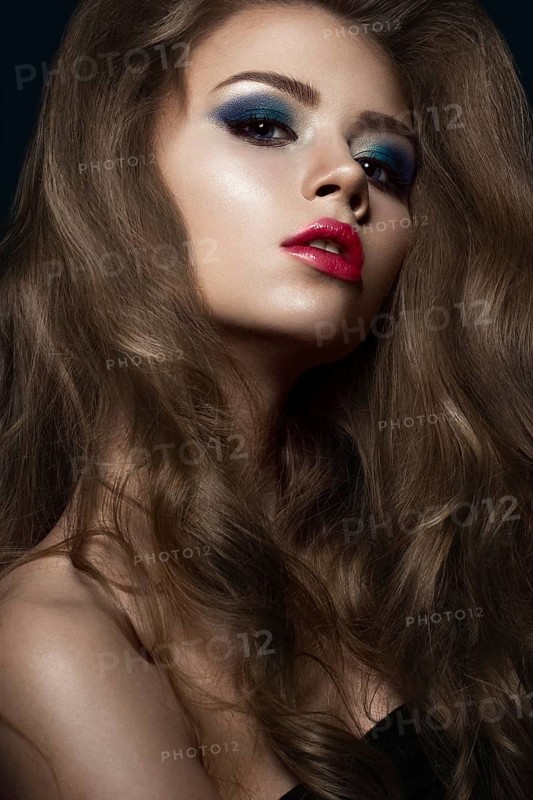 Beautiful girl in Hollywood manner with curls