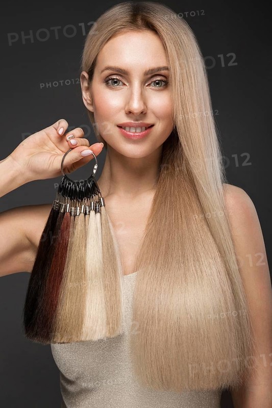 Beautiful blond girl with a perfectly smooth hair