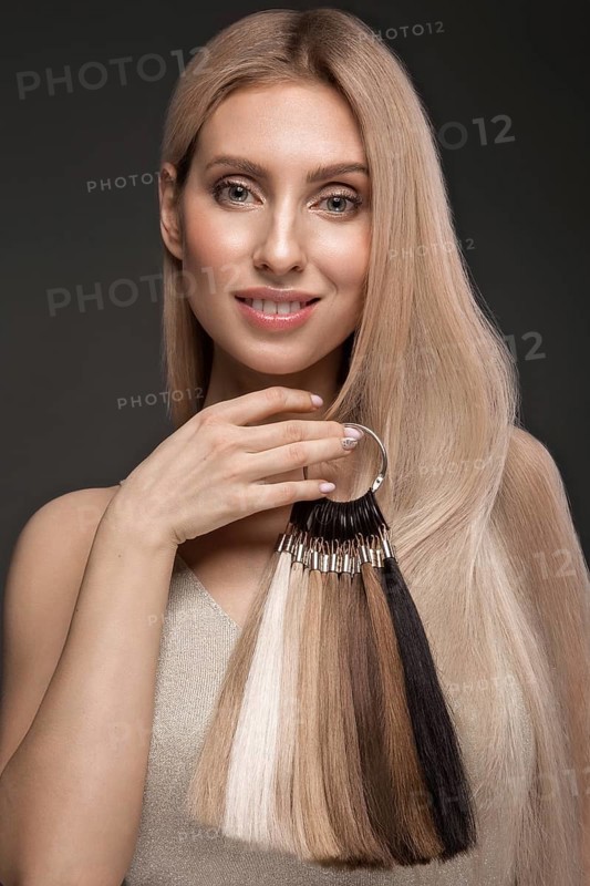 Beautiful blond girl with a perfectly smooth hair