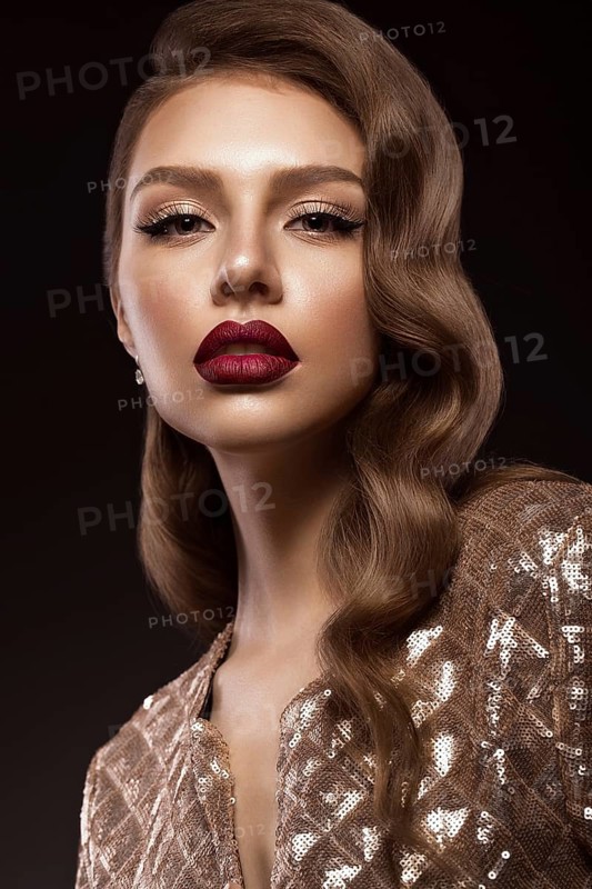 Beautiful girl in Hollywood image with wave and classic makeup. Beauty face. Photo taken in the studio