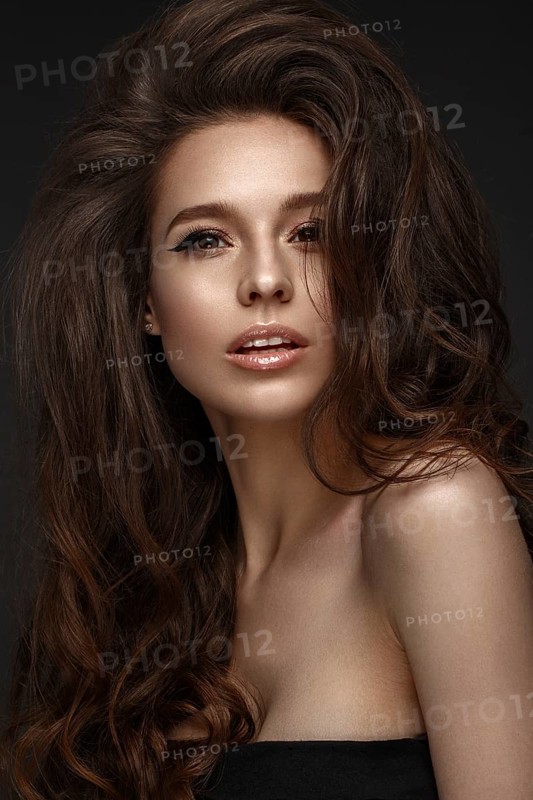 Beautiful brunette model with volume curls