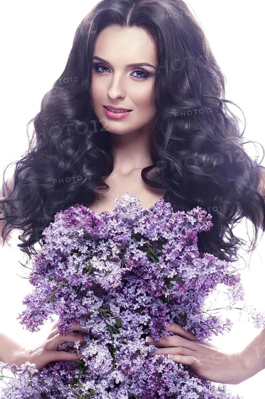 Beautiful brunette girl with a gentle romantic make-up