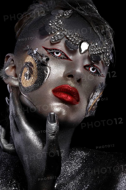 Portrait of a girl with creative art make-up. Unusual image. Photo taken in the studio
