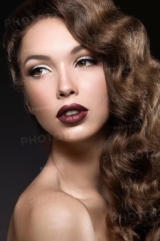 Beautiful woman with evening make-up and long hair