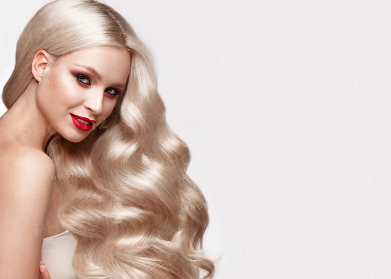 Beautiful blonde in a Hollywood manner with curls
