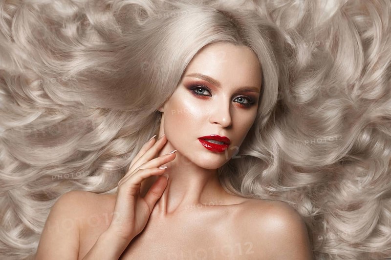 Beautiful blonde in a Hollywood manner with curls