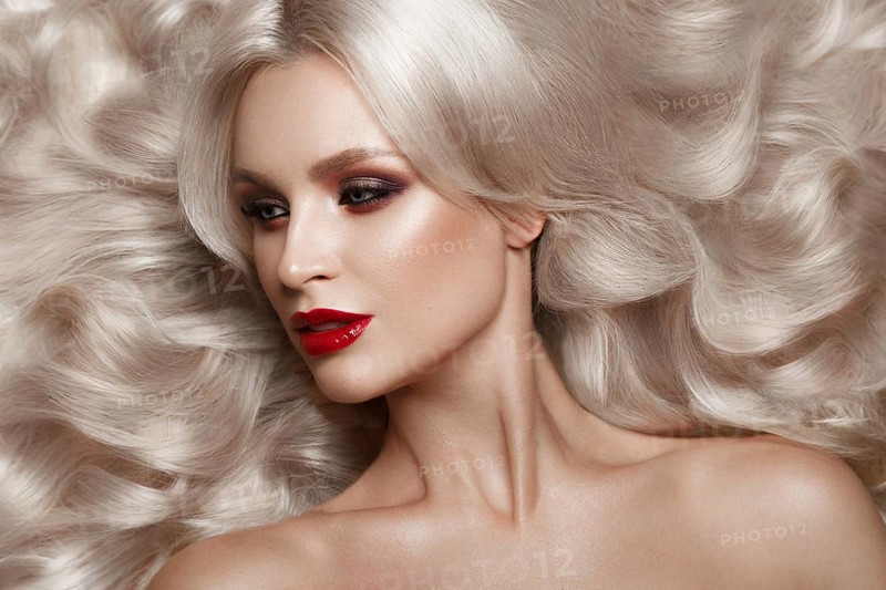 Beautiful blonde in a Hollywood manner with curls