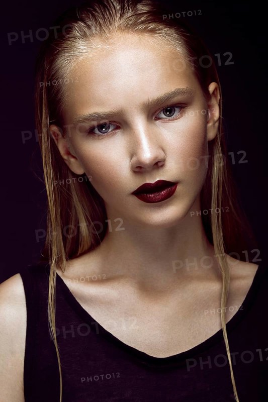 Fashion model is posing in studio for test photo shoot showing different poses