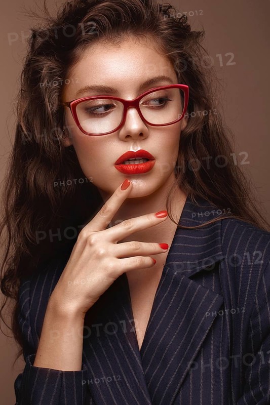 Beautiful girl in stylish clothes with glasses for vision. Beauty face. Photo taken in the studio