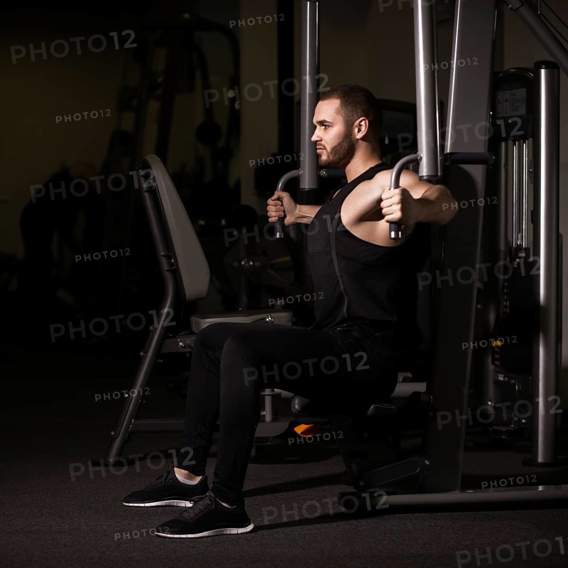 Sporty sexy men with great abdominal muscles in black sportswear