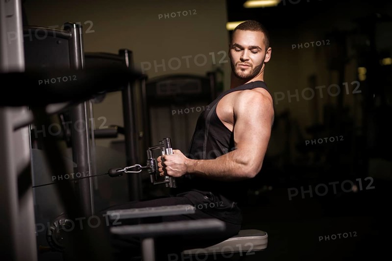 Sporty sexy men with great abdominal muscles in black sportswear