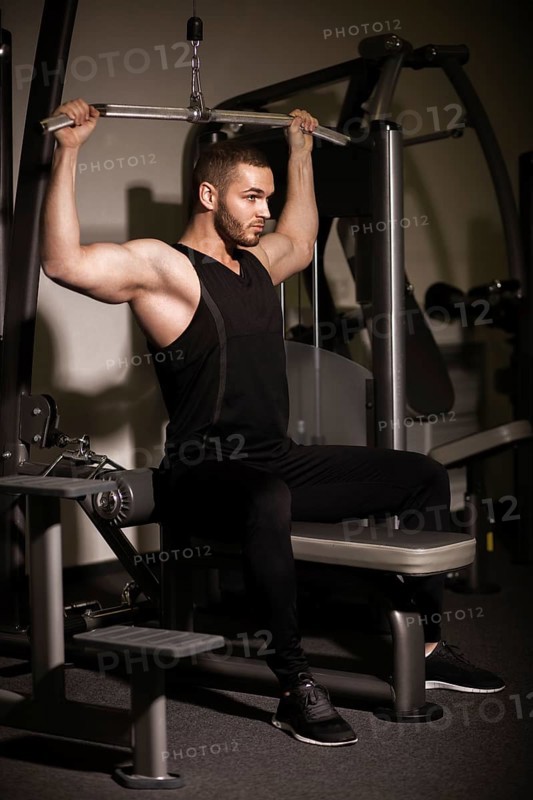 Sporty sexy men with great abdominal muscles in black sportswear