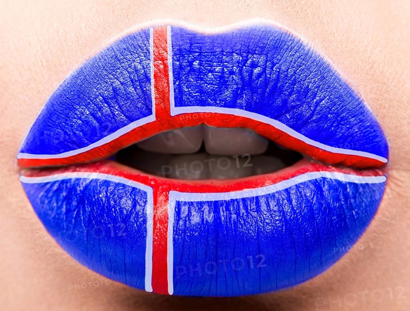 Female lips close up with a picture of the flag of Iceland. Blue