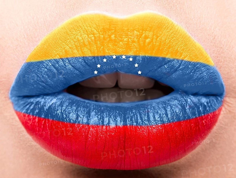 Female lips close up with a picture of the flag of Venesuela. Blue
