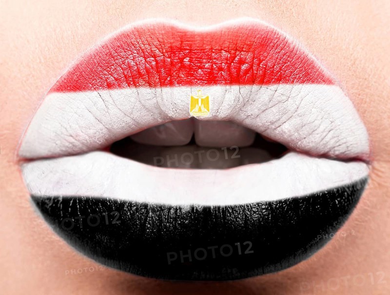 Female lips close up with a picture of the flag of Egypt. white