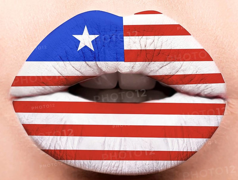 Female lips close up with a picture of the flag of Liberia. white